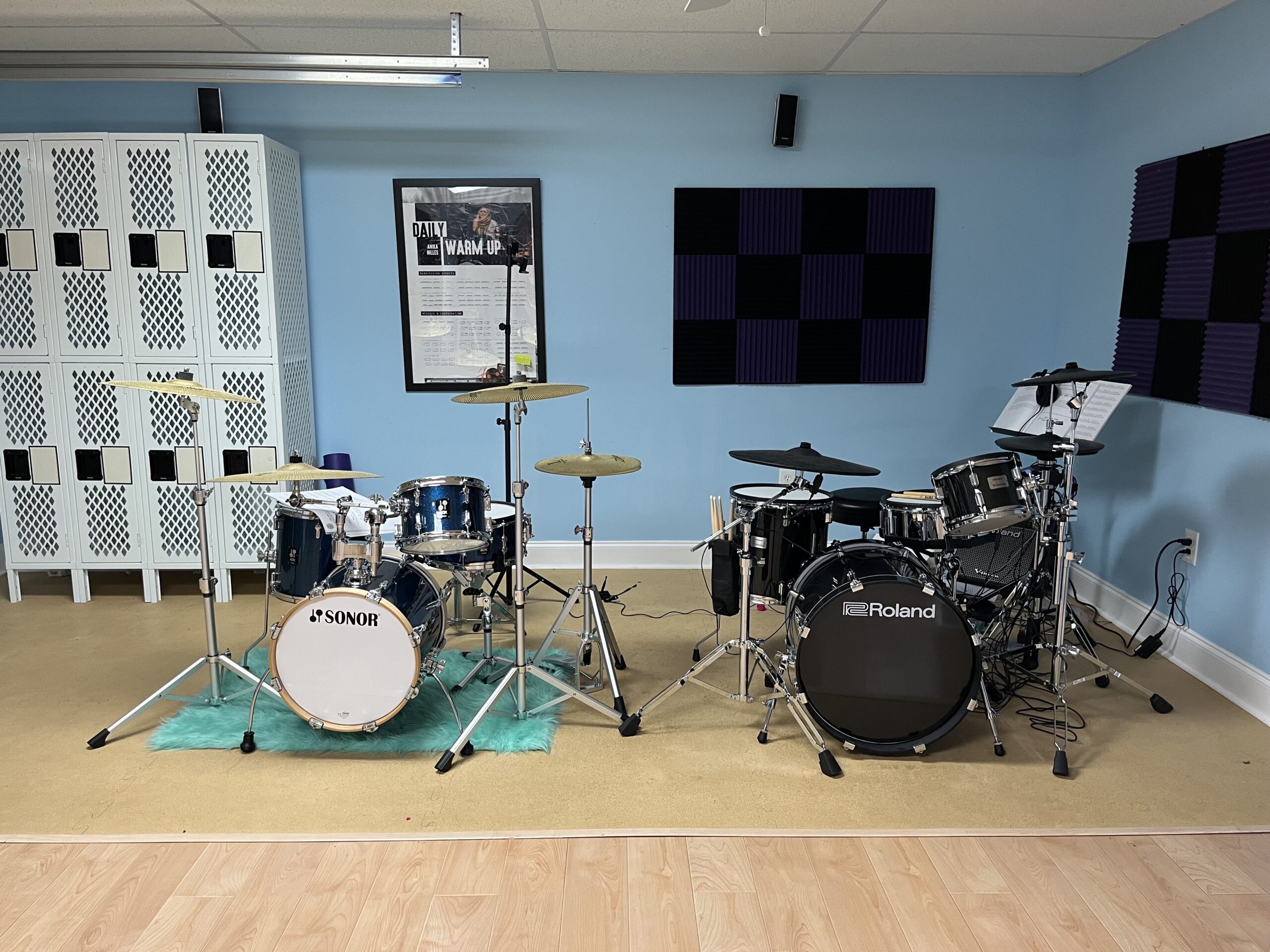Acoustic and electronic drum kits in Brittany's teaching studio