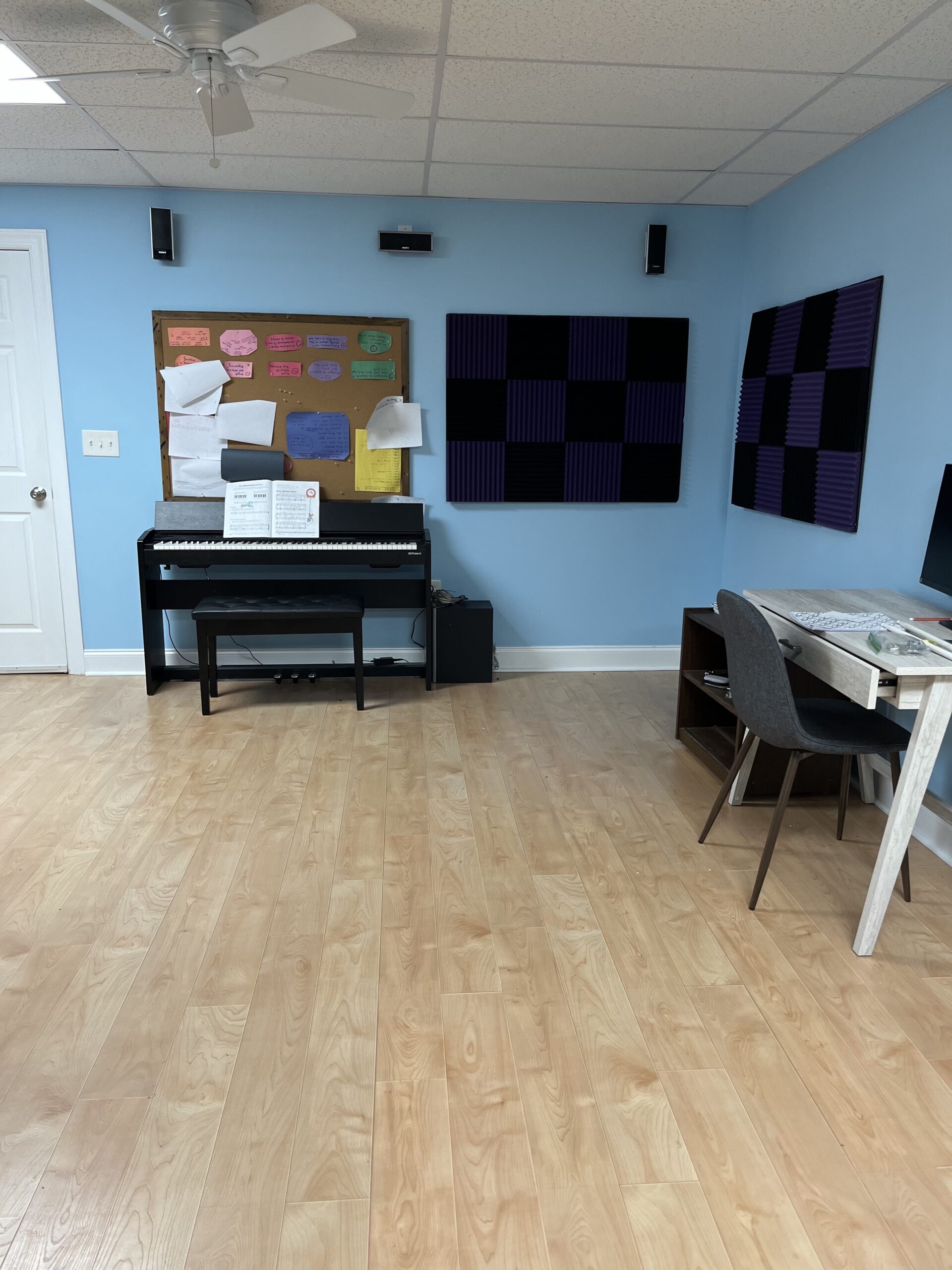 Piano lesson corner with digital piano and music stand